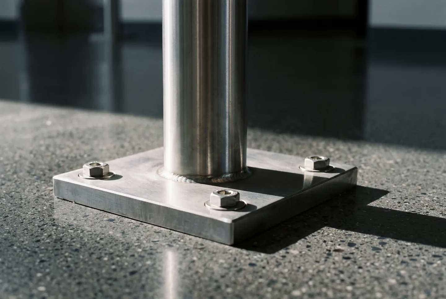 A steel railing post being installed