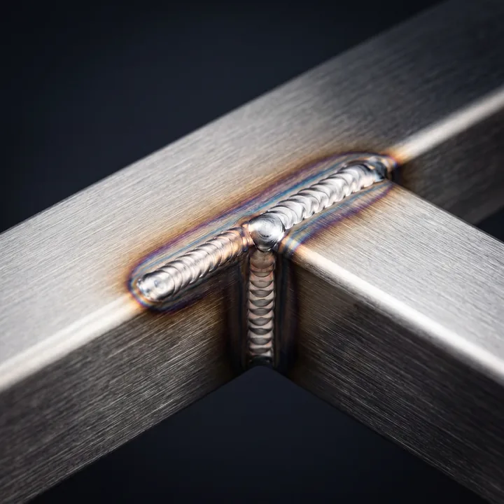 Close-up of a clean steel railing weld